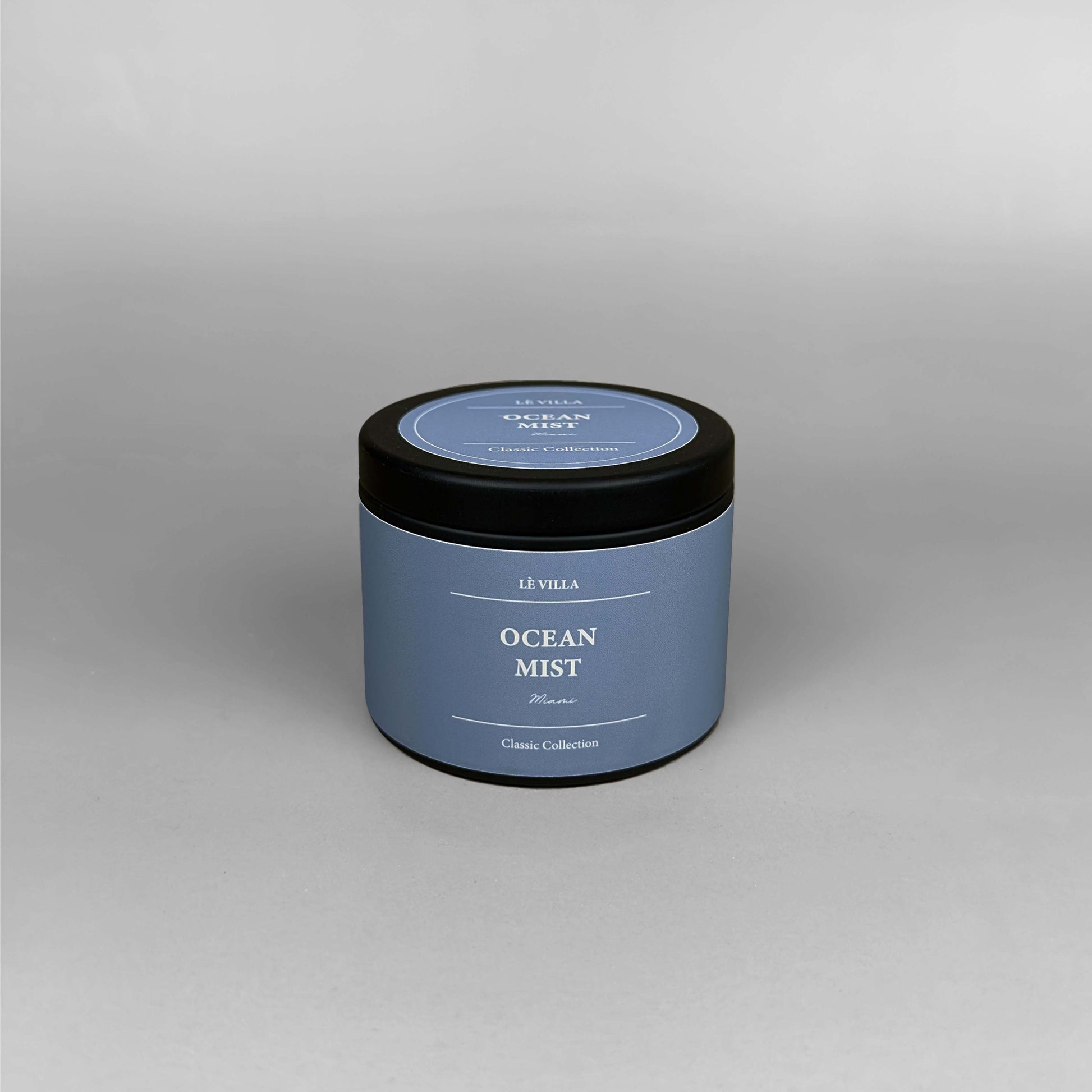 4oz Ocean Mist candle with matching label and glass design, styled as part of a serene coastal-inspired set.
